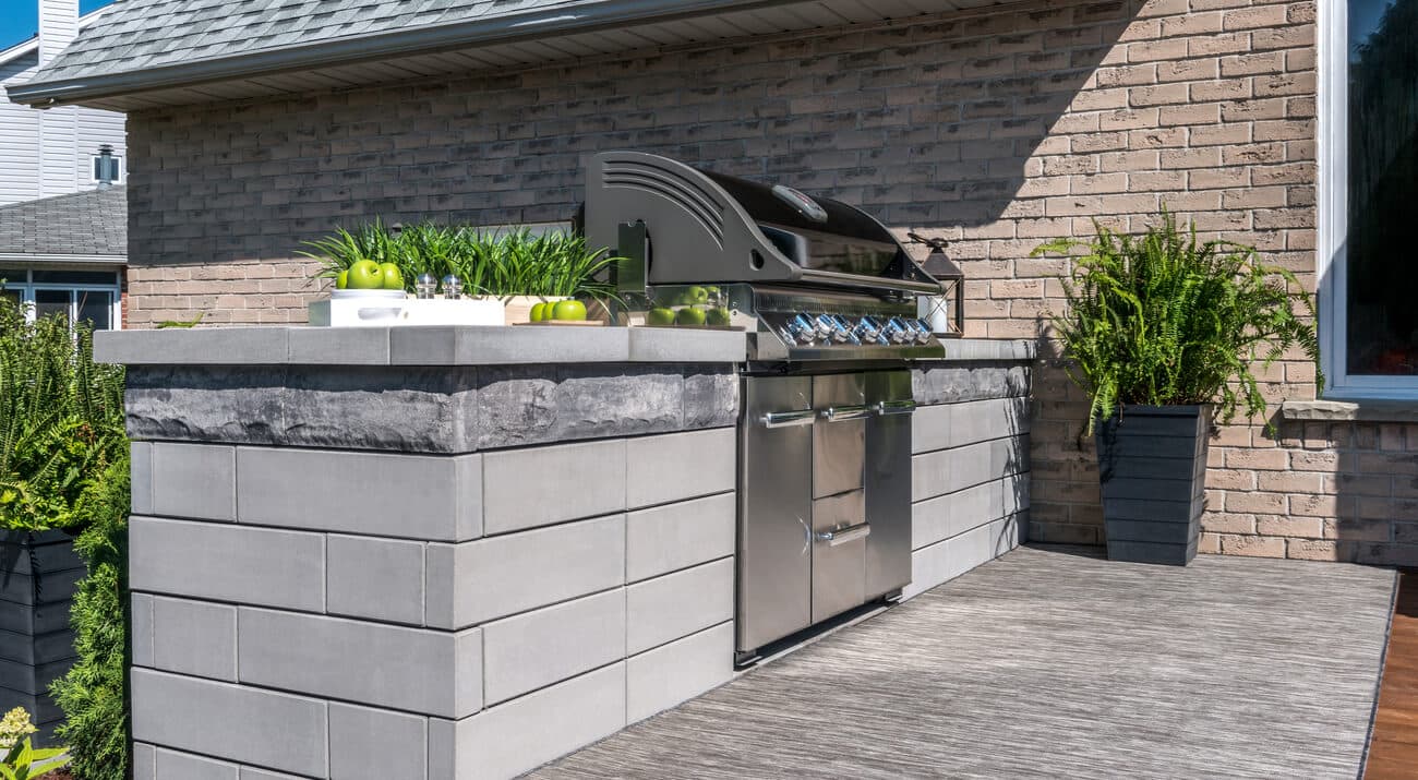 Unilock outdoor kitchen with bar seating